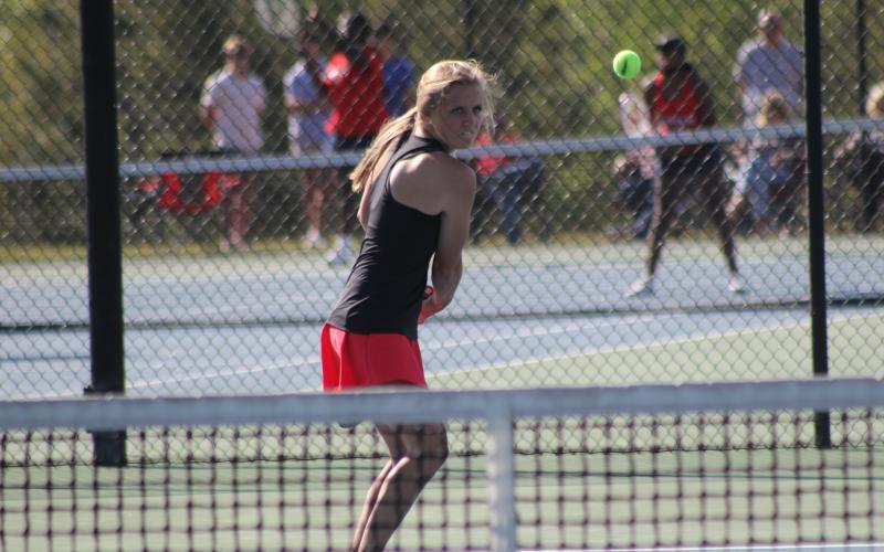 Stephens County No. 1 singles player Madison Rogers loads up for a backhand stroke during Monday’s first round state playoff action against Murray County.