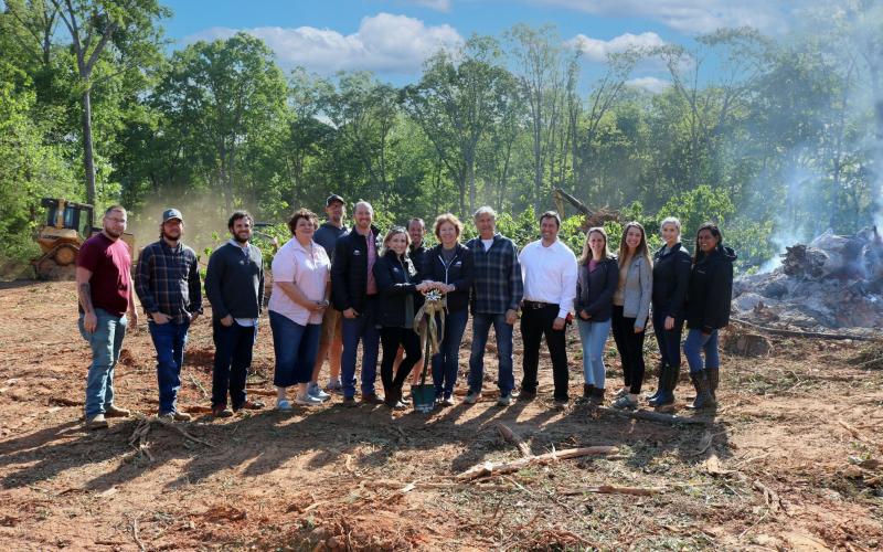 Shepherd’s Hill Academy staff gathered in April  for the groundbreaking ceremony for the academy’s new multi-purpose dining hall. Pictured in the center are academy founders Trace and Beth Embry. 