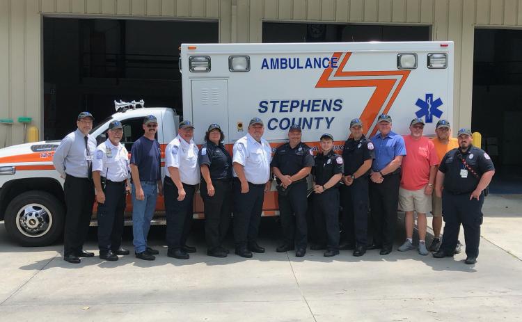 Past and present members of the Stephens County EMS recently gathered to kick off the celebration of the 50th anniversary of the ambulance service. Pictured are (from left) hospital CEO Mike Hester, EMS director Aaron Wilkinson, Andrew Burkhart, Chris Stephens, Donna Kieffer, Bobby Westmoreland, Matt Moore, Jake Murray, Blake Simpson, Stanley Ansley, James Norris, Tony Thomas and Joshua Smith.