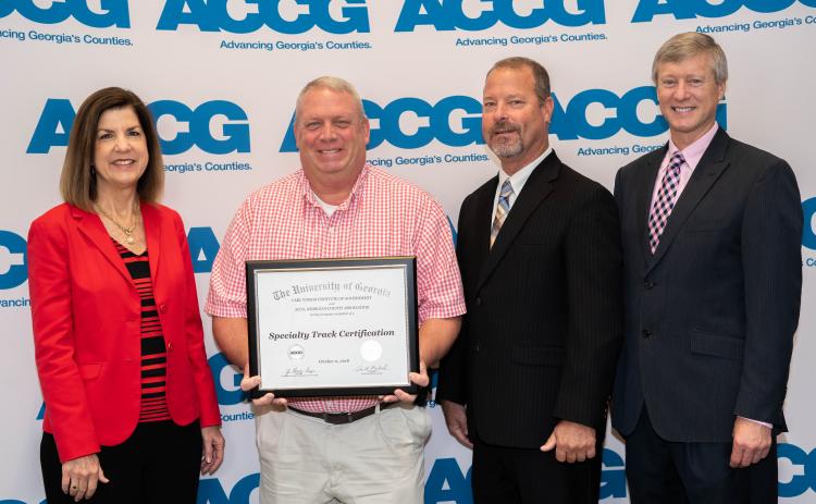 Stephens County commissioner Dennis Bell (second from left) recently received the economic and community development specialty track from the ACCG’s Lifelong Learning Academy.