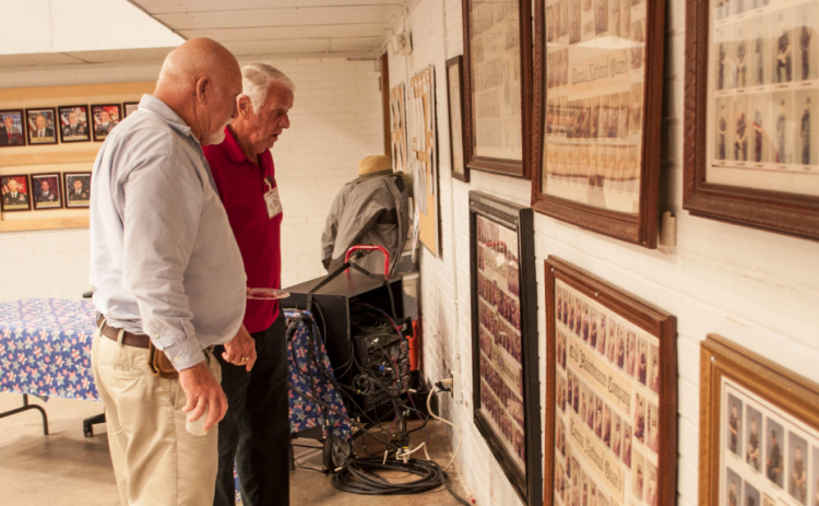 ‘Old Guard’ members Nicky Willis and Benny Cheek check the National Guard photos from the 1980s.