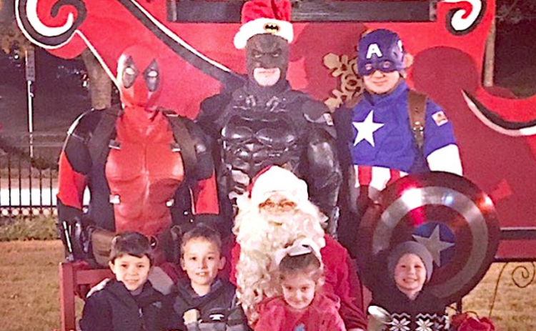 Heroes in Force (standing) met with Santa and some of his new friends at last year’s event.