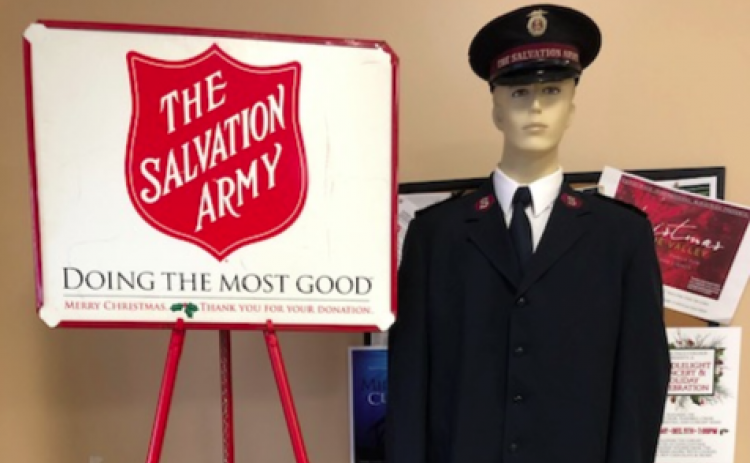 Iconic Salvation Army red kettles will be accompanied by human bell-ringers. This season apps to make a donation at the kettle also are offered.