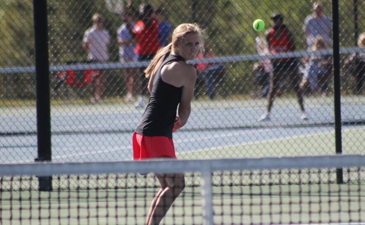 Stephens County No. 1 singles player Madison Rogers loads up for a backhand stroke during Monday’s first round state playoff action against Murray County.