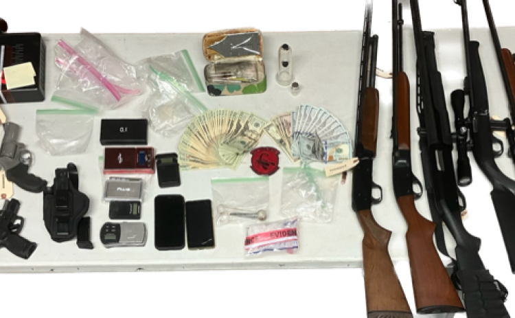 These are the guns, cash, and suspected drugs seized by STING unit officers  during a recent search of a Cheek Smith Road residence.