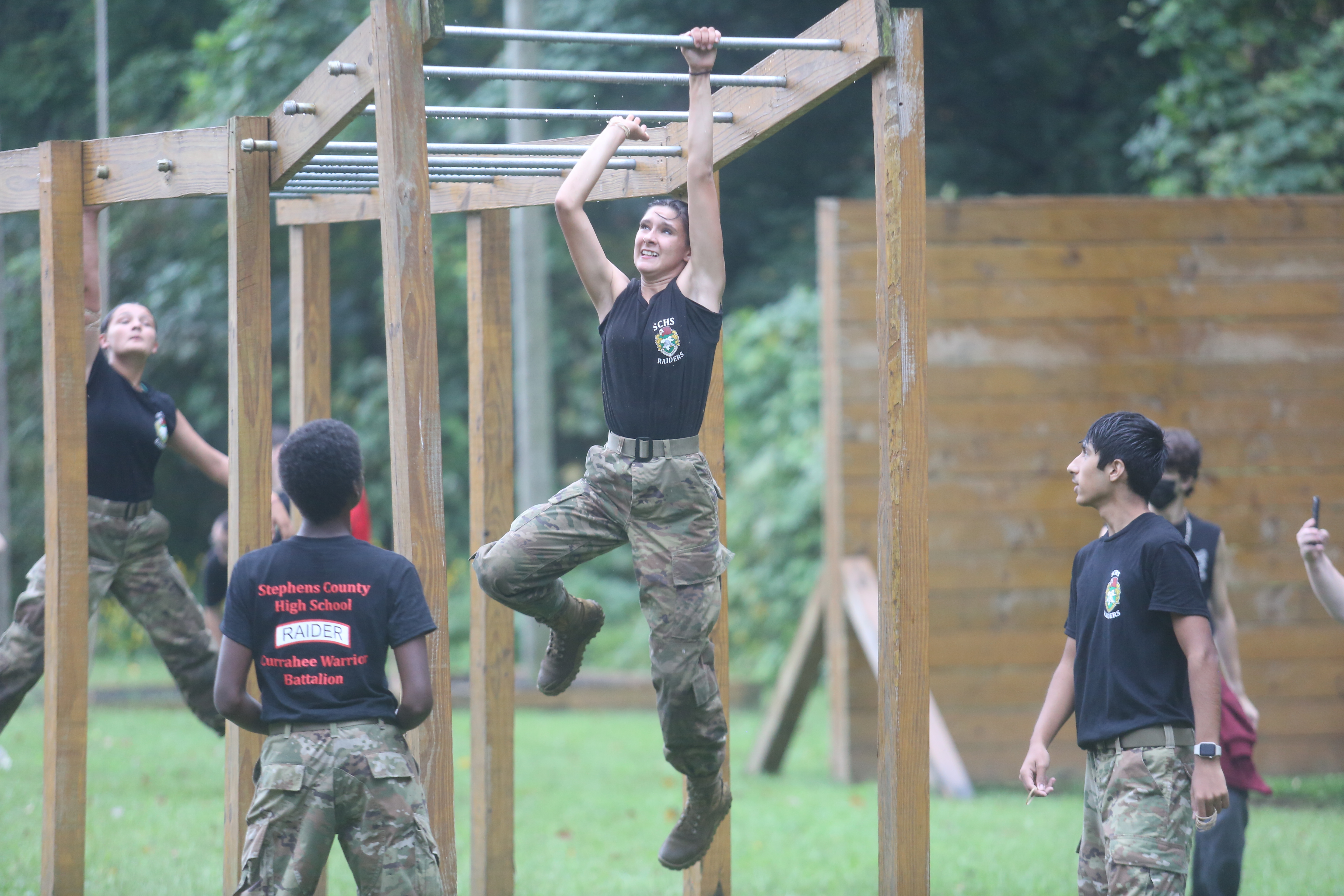 Amidst the pouring rain on Saturday, Sept. 12, the Stephens County High School for the first time hosted a JROTC Raiders meet behind the school. The group built an obstacle course for the event, and several regional schools flocked to Toccoa to participate from as far away as Athens-Clarke County. Swinging from the monkey bars here in the downpour is Bethany Byrd.