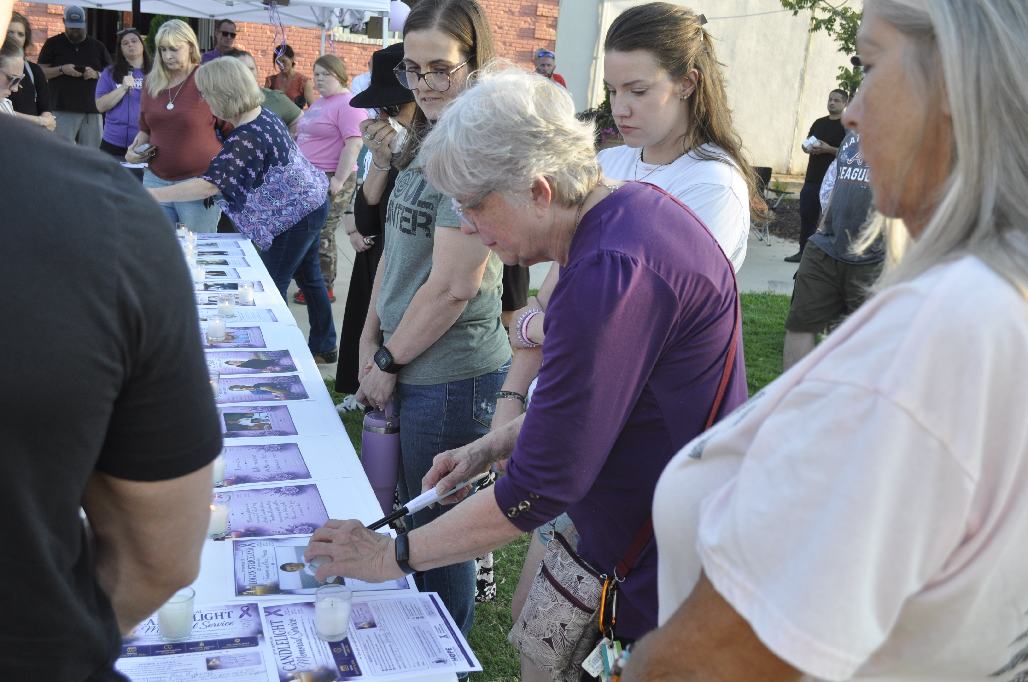 On Sunday, Aug. 30, Hope for a Drug Free Stephens held its fourth annual remembrance event at the Tugalo Greenspace.Among those in attendance was Kathy Petraeus, seen here lighting a candle in memory of her son, Logan.