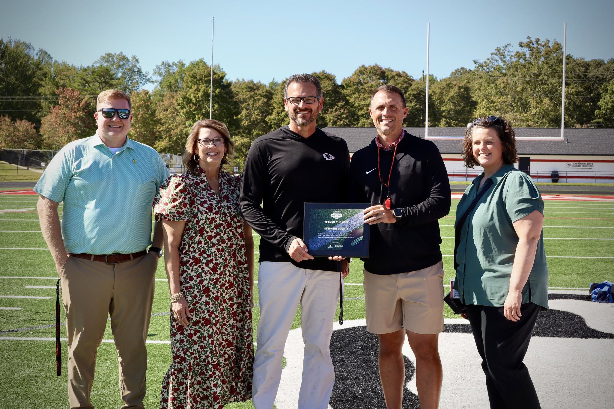 The Stephens County Indians football team received the Atlanta Journal Constitution/Georgia High School Football’s Team of the Week award on Thursday, Oct. 8, for its stunning performance against Hart County on Friday, Oct. 2. During that game, the Indians had a wild comeback win over the visiting Bulldogs, rallying from a 22-point deficit in the first half to beat Hart 44-28. Accepting the award on behalf of the Stephens County School System were assistant schools superintendent John Stith, SCSS superinten