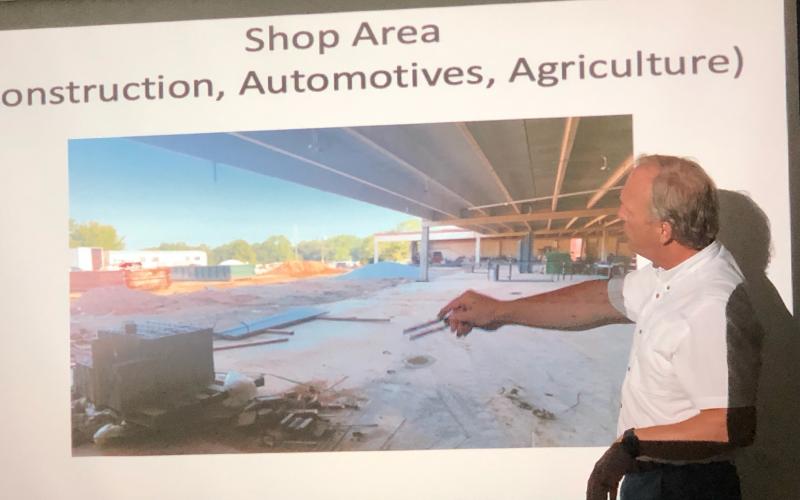 School superintendent Bryan Dorsey shows school board members the ongoing work that’s underway at the high school, an area into which automotive, construction and agriculture classes will move.