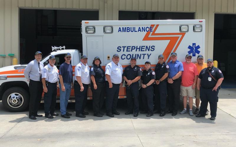 Past and present members of the Stephens County EMS recently gathered to kick off the celebration of the 50th anniversary of the ambulance service. Pictured are (from left) hospital CEO Mike Hester, EMS director Aaron Wilkinson, Andrew Burkhart, Chris Stephens, Donna Kieffer, Bobby Westmoreland, Matt Moore, Jake Murray, Blake Simpson, Stanley Ansley, James Norris, Tony Thomas and Joshua Smith.
