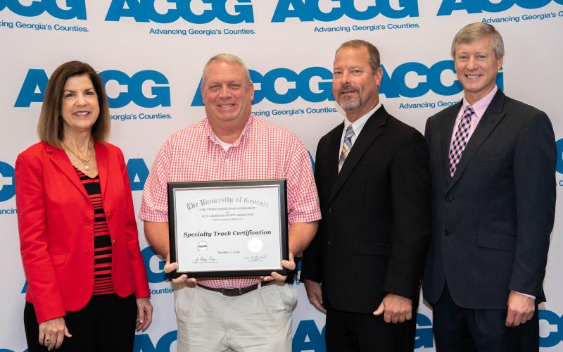 Stephens County commissioner Dennis Bell (second from left) recently received the economic and community development specialty track from the ACCG’s Lifelong Learning Academy.