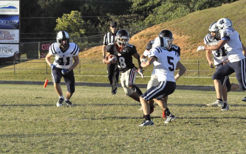 Bryson Trimier runs the ball against White County