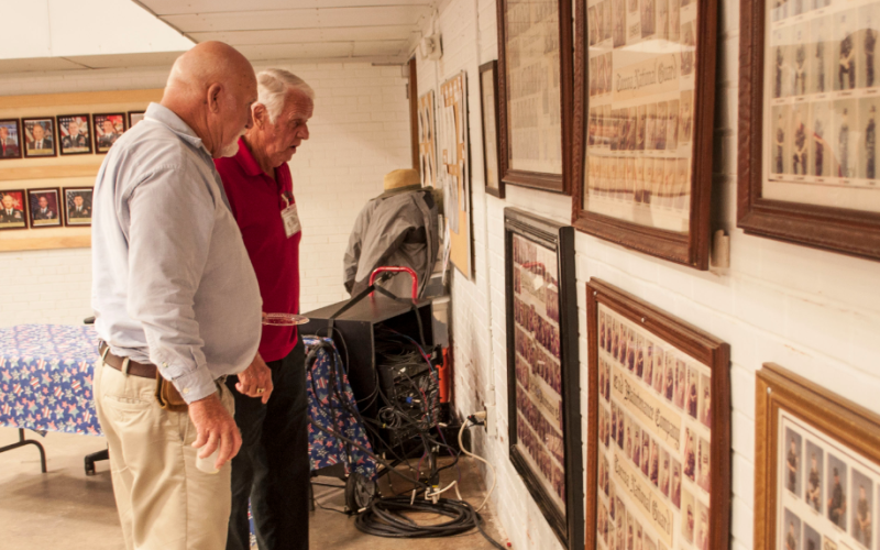 ‘Old Guard’ members Nicky Willis and Benny Cheek check the National Guard photos from the 1980s.