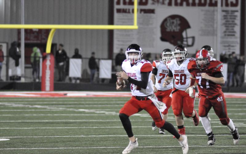 Stephens County quarterback Kenny Colwell sprints for extra yardage in a game from last Friday. SCHS teams will be competing in AAA instead of AAAA next season.