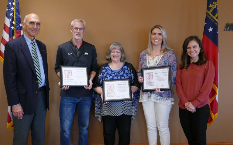 Stephens County graduates at the Oct. 29 ceremony included Jason Scott, Mary Smith and Samantha Rickman. They are pictured with Carrie Barnes of Georgia EMC (right) and Rope Roberts of Georgia Power Company (left).