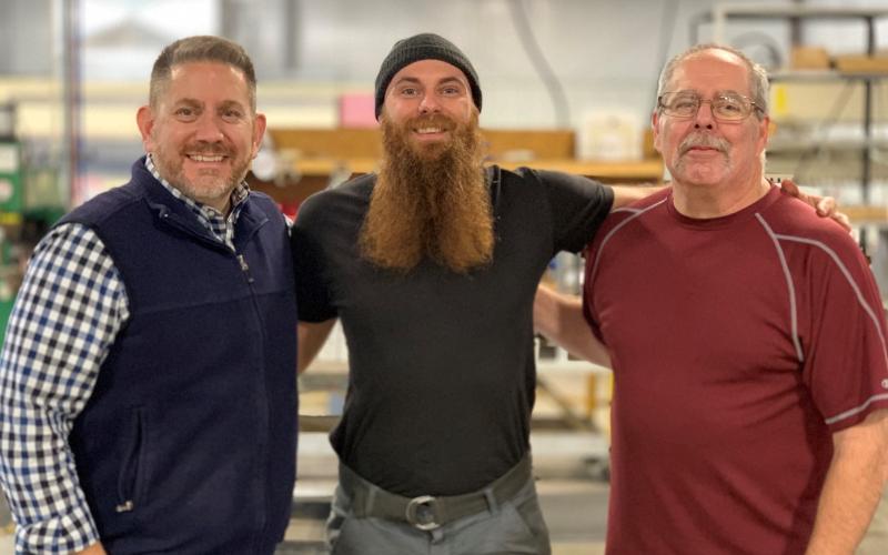 Pictured are (from left) Jon Heffer, PTL president and CEO;  Jamie Whitfield, sheet metal technician and 2019 Employee of the Year; and John Buchanan, PTL production manager and the 2018 PTL Employee of the Year.