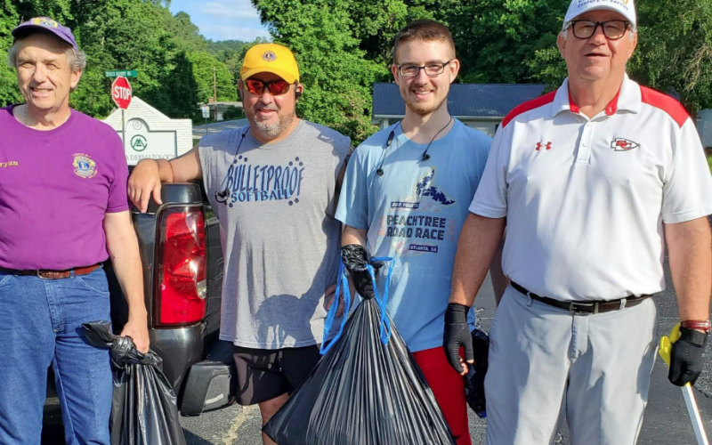 Pictured are Lions Club members resting after cleaning up litter along Falls Road last Saturday.  They are (from left) Bryan Gordon, Tim McLaughlin, Jack McLaughlin and Jack McLaughlin. Lions not pictured are Brenda Gordon, Jack Barnard and Dan Huff.