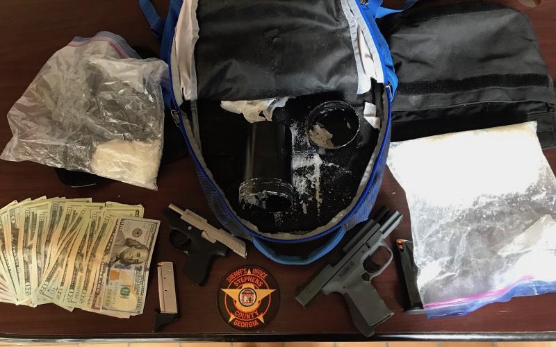 These are some of the suspected drugs, cash and a handgun seized during a recent traffic stop that led to the arrest of three people.