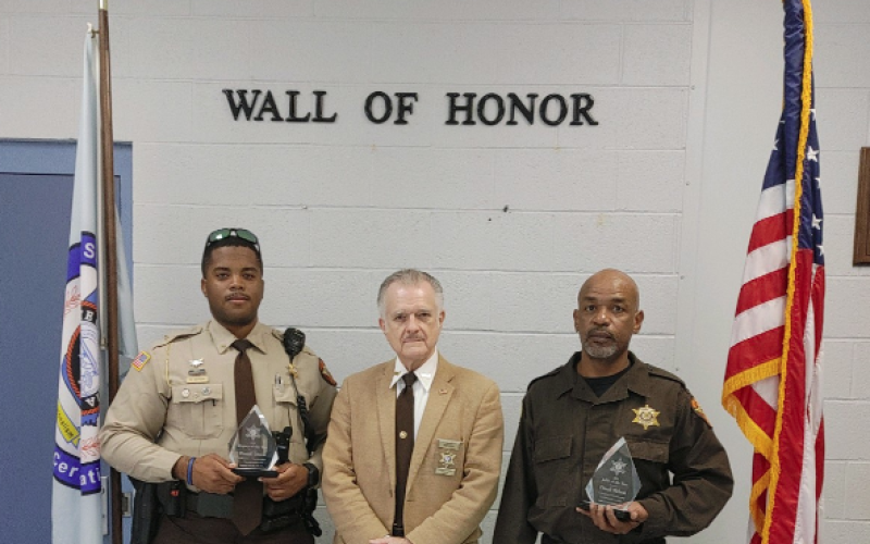 Receiving deputy of the year and jailer of the year awards were Daniel Dixon (left) and Dondi Nelson (right). The awards were presented by Stephens County Sheriff Randy Shirley (center).