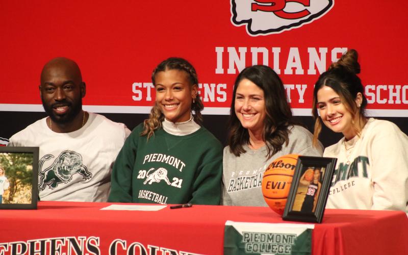 Kiki Howard and family during her signing ceremony
