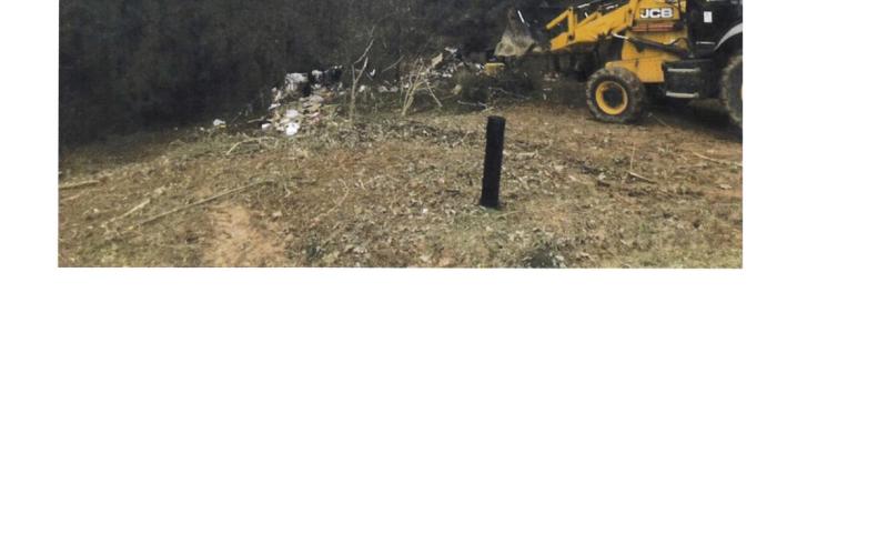Heavy machinery was used to remove ramshackle temporary housing in areas off Stephens Circle and Stephens Extension.