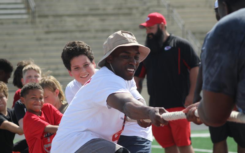 A.J. Howard playing tug of war during a football camp at Stephens County