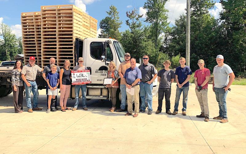 Pictured are (from left) WBL coordinator LaDonna Bartmas, Hollow Springs Farms owner Peter Traudt, Michael Pless, Cooper Pless, Kelly Pless, Garrett Pless, CTAE director Pam Hill, Bradley Westmoreland, WBL coordinator Rod Pipkin, SCHS welding instructor Chris Holland, John Hughes, Jacob Traudt, Trent Brooks, Samuel Traudt.