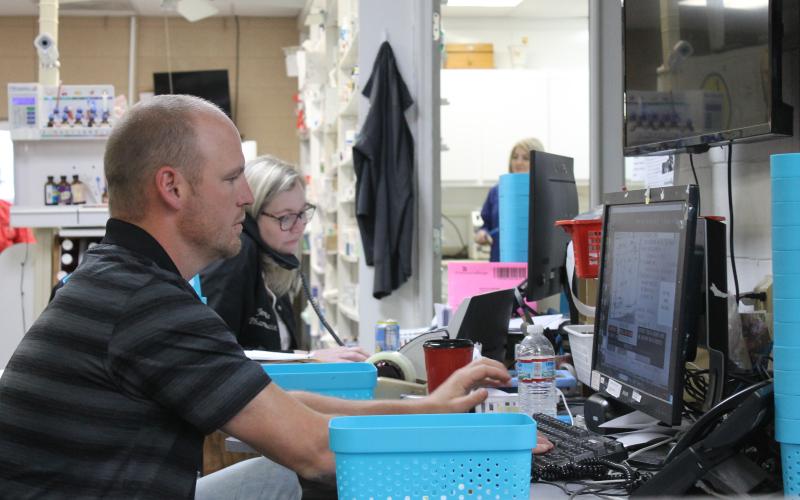 Sam Freeman and Jenny Brawner work at Maddox Drugs, a pharmacy in Toccoa.