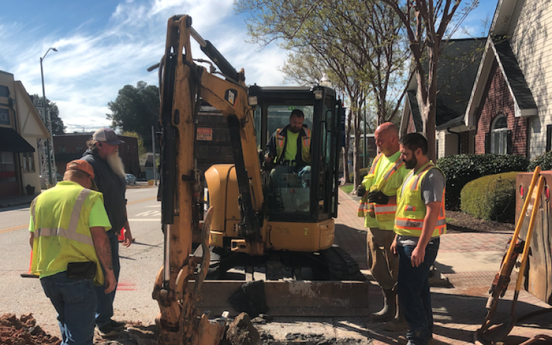 City workers repair a sewer line on Sage Street.
