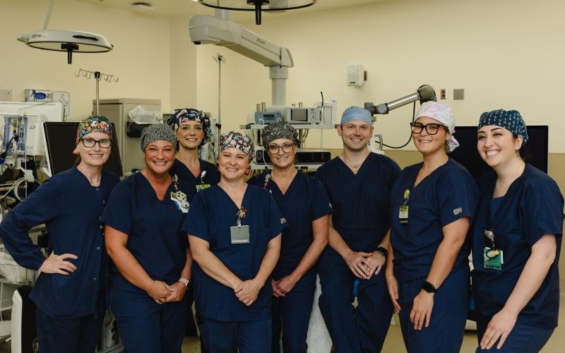 The operating room team at Northeast Georgia Medical Center Gainesville poses for a photo before completing the state of Georgia's first histotripsy procedure on Friday, April 19, 2024. From L-R: Caroline Chotas, RN; Kristy Foutty, CST; Casey Patton, RN, CNOR; Stephanie Sullins, CST; Shannon Sutton, RN, CNOR; Nelson Royall, MD; Ambar Riffi Temsamani, PA-C; Cierra Triggs, CST.
