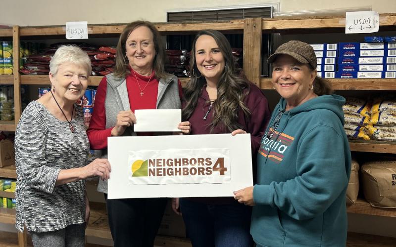 Pictured are Lucy Davis, vice president of Neighbors 4 Neighbors, Deborah Gibby,  president, Peach StateFCU Business Development Coordinator Brooke Westbrook, and Dee Scarborough, N4N scretary and member of the Peach StateFCU Northeast Georgia Region Advisory Board. Photo submitted by Dee Scarborough.