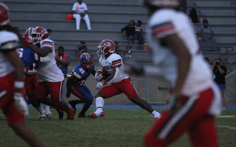 Senior Running Back Javin Gordon looks for a hole to run through in Friday night's game against Cedar Shoals.