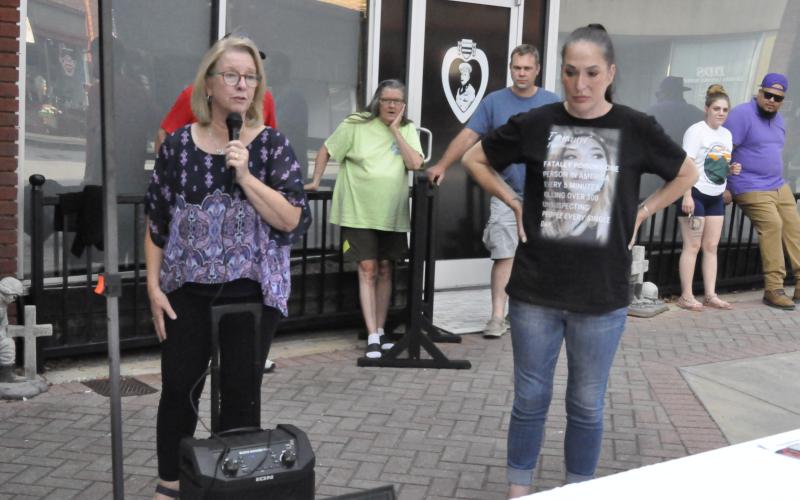 Kathy Whitmire, left, executive director for the Hope for a Drug Free Stephens oganization, and guest speaker Julie Russell, right, led a drug overdose awareness event on Thursday, Aug. 29, in downtown Toccoa.