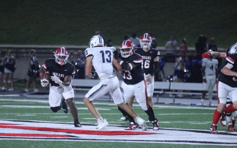 Javin Gordon carries the ball down the field during a home Stephens County football game this season.