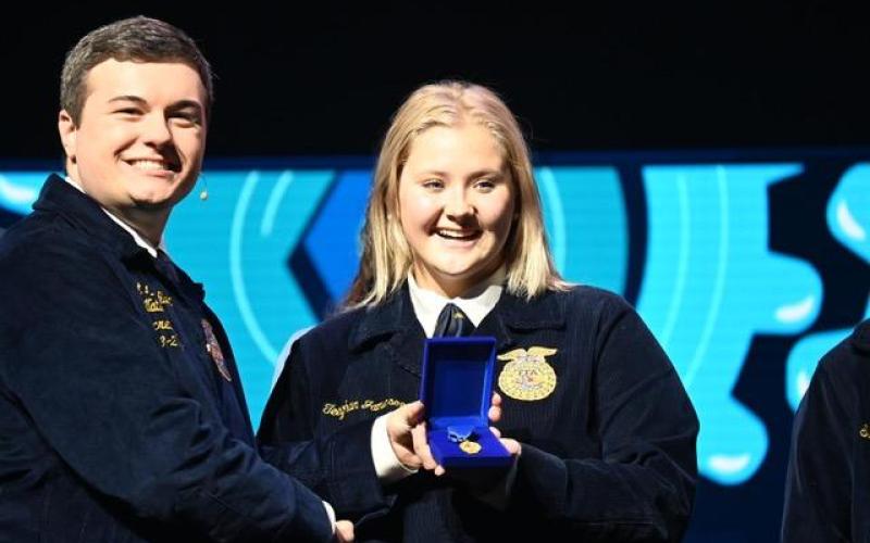 The Stephens County Future Farmers of America compete in Indianpolis in October. Teeghan Jameson, center, was a National Proficiency Award finalist and won the nation title in Environmental Natural Resource Management. On the left is Gran Norfleet, National FFA Secretary.