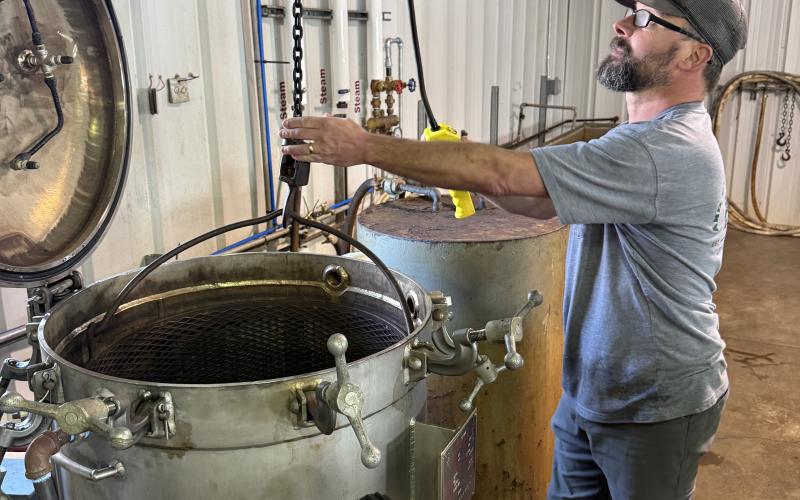 Richard Johnson working on canning at the Eastanollee Cannery.