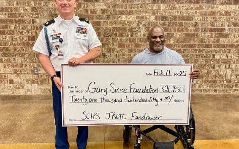 JROTC senior instructor LTC (Ret) David Priatko presented a $21,250 check to his West Point classmate and Gary Sinise Foundation board member Col. (Ret) Greg Gadson at the SCHS African American History Program.