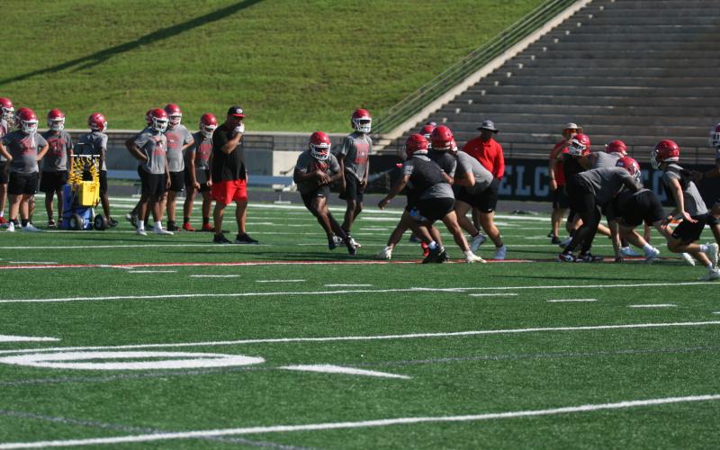 The Indians high school football team is hard at work finishing off the month of June practices this week before enjoying an off week next week. The Indians will resume practice on July 7. Pictured below are the Indians running through drills during their early morning practice. They will start workouts in full pads in July. Photo by Laura Shaw.