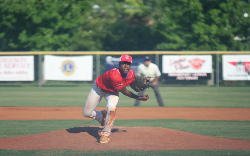 Carmelo Renfroe started the game pitching for Toccoa. Above, he is pitching a volley. Photo by Laura Shaw