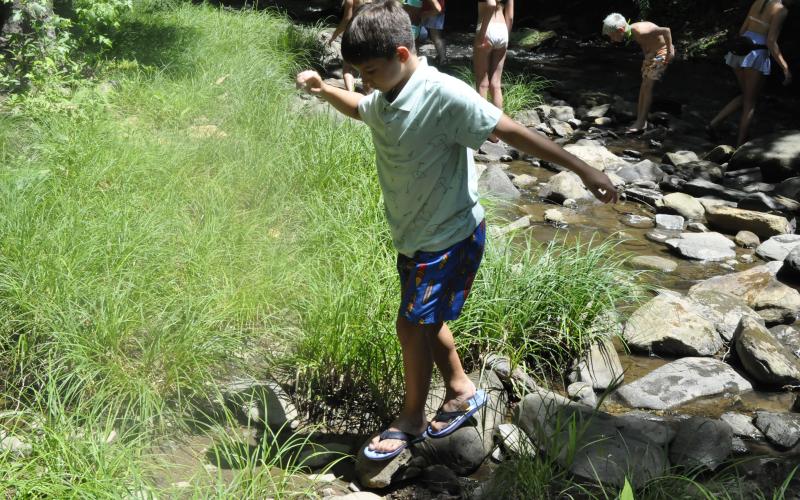 On Monday afternoon, children played in Toccoa Creek as part of their summer camp activities at Camp Mikell. Photo by Michael O’Hearn