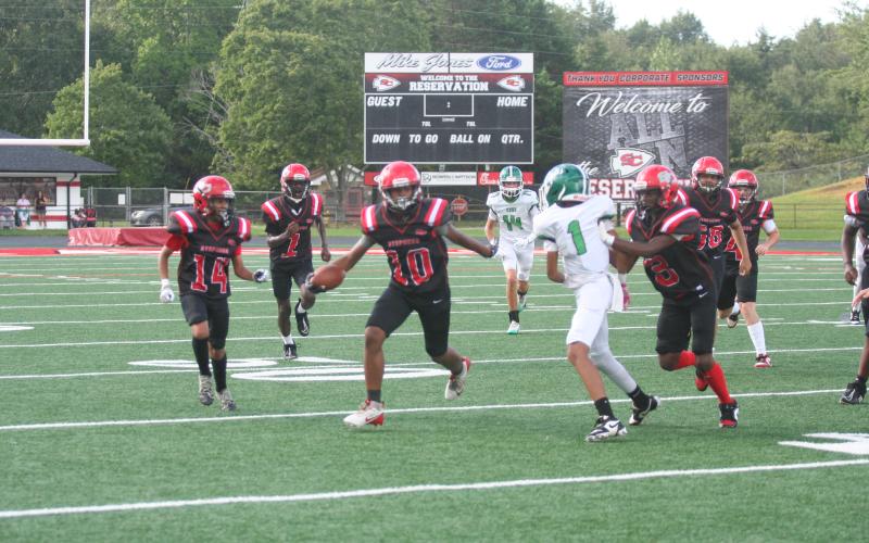 Aiden Cobb, middle, runs down the field, guarded by Jerymus Roberson on the left and Tyquavian Stanley running behind him. Laura Shaw/The Toccoa Record
