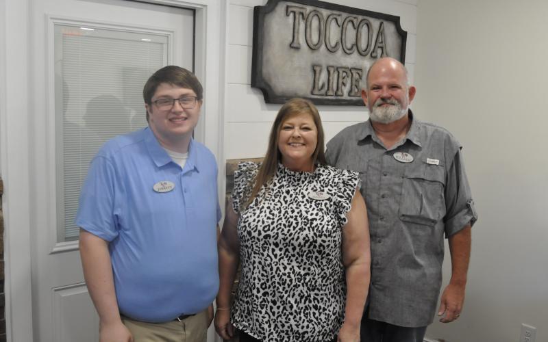 The Toccoa Family Life Resource Center has opened a new headquarters. This is the first time in the organization’s 40 year history that it has had a permanent building in town. Pictured are Toccoa Family Life Center Executive Director William Brothers, his wife, Amanda, and the facility’s office manager, Jarrett. Michael O’Hearn/The Toccoa Record