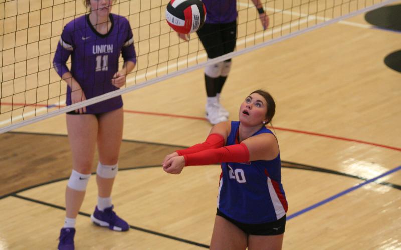 Mallie Kate Underwood sets the ball during one of the home volleyball matches last week.