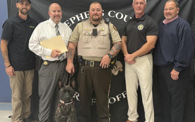The Stephens County Sheriff’s Office welcomed K-9, Taz, following the death of the previous K-9 there, Champ, on Sunday, Oct. 19. Pictured from left to right are K9 Justice Dog Training owner Wesley Ballenger, Maj. Bill Zigan, Sgt. David Kiser, Sheriff Rusty Fulbright, and Maj. Jimmy Mize.