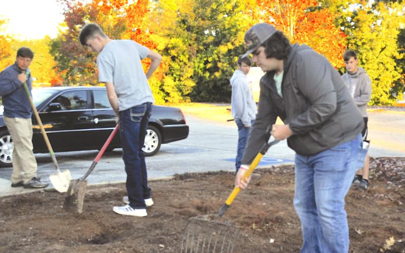 Camden Gibbs joined other Stephens County High School agricultural education students in preparing a monarch butterfly garden spot at the Toccoa-Stephens County Chamber of Commerce.