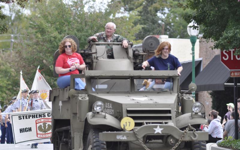 Currahee Military Weekend returned to Stephens County and had an itinerary of events planned over the weekend, ranging from a USO dance at Camp Toccoa to a veterans parade on Doyle Street in downtown Toccoa. Above is Syd Lawson riding a big green tractor in the parade on Saturday afternoon. Below in the halftrack vehicle are, from left to right, Jessica Boone, Gerald Shedd, Katie Patrick and Michael Patrick.