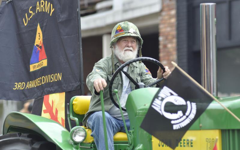 Currahee Military Weekend returned to Stephens County and had an itinerary of events planned over the weekend, ranging from a USO dance at Camp Toccoa to a veterans parade on Doyle Street in downtown Toccoa. Above is Syd Lawson riding a big green tractor in the parade on Saturday afternoon. Below in the halftrack vehicle are, from left to right, Jessica Boone, Gerald Shedd, Katie Patrick and Michael Patrick.