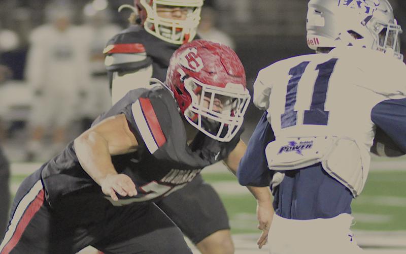 Indian offensive lineman Conner Holtzclaw (77) has an East Jackson player squarely in his target area.