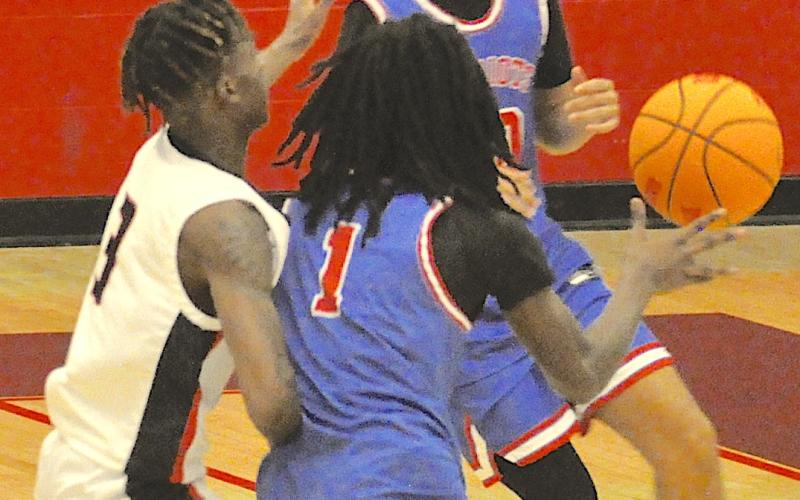 Stephens County’s C.J. Harbin (3) pressures an Oglethorpe player with the basketball here last Friday.