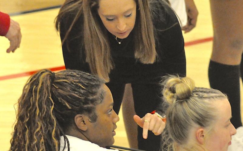 SCHS girls basketball coach Tess Wright gives some last minute instructions to Lanesia Verdell (left) and Emma Kate Powell just seconds before the Lady Indians take the floor against Oglethorpe County.